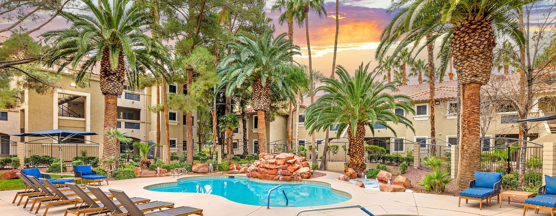 Resort-style swimming pool with lounge seating