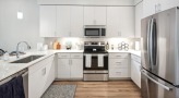 a kitchen with under cabinet lighting