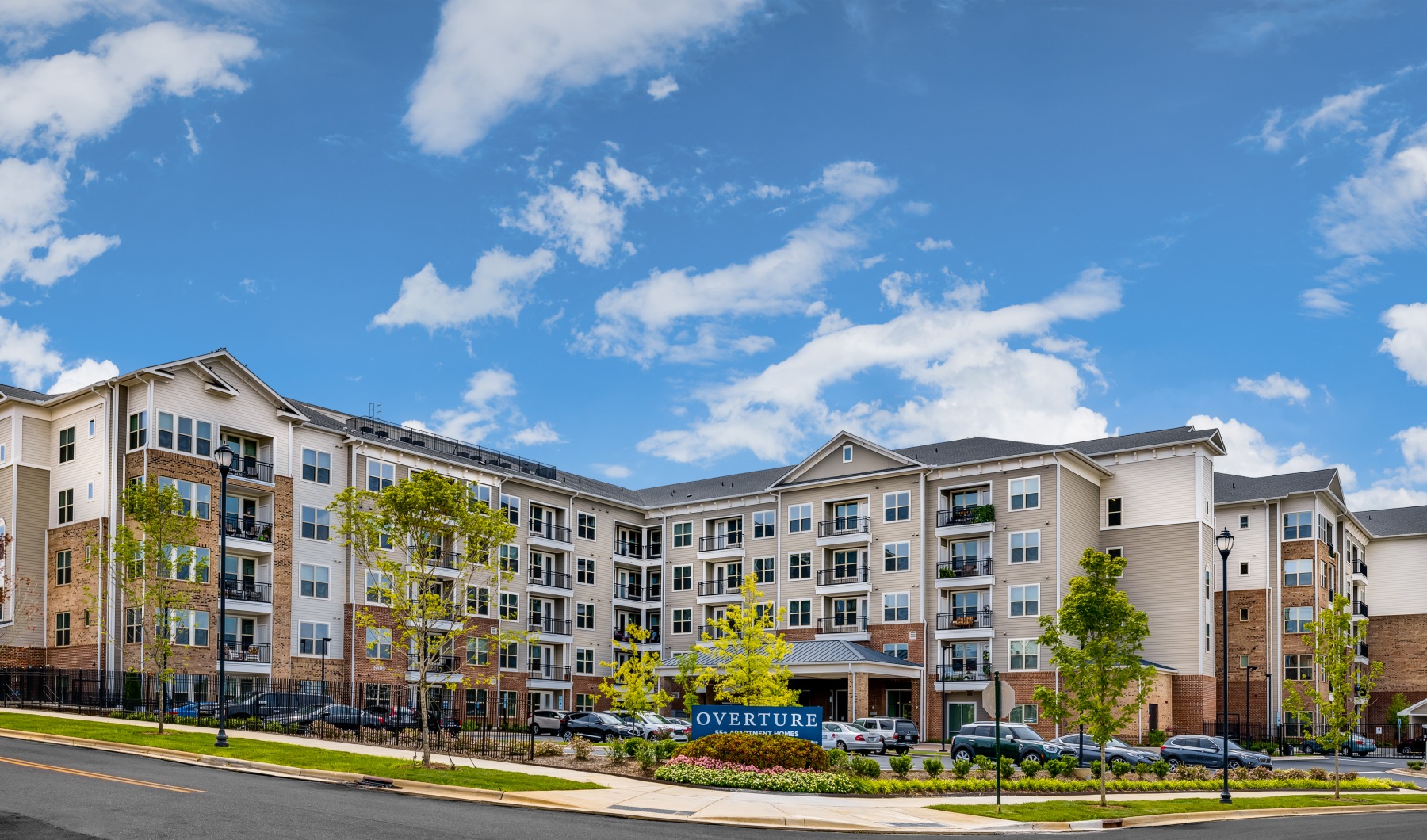 Exterior view of the front of 55+ community on sunny day