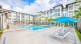 umbrella shaded lounge chairs by pool