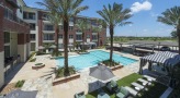 aerial shot of pool with cabanas and lounge area