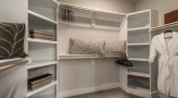 spacious walk-in closet with shelving