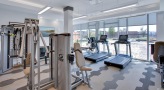 bright gym with floor-to-ceiling windows