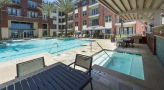 a swimming pool and covered jacuzzi