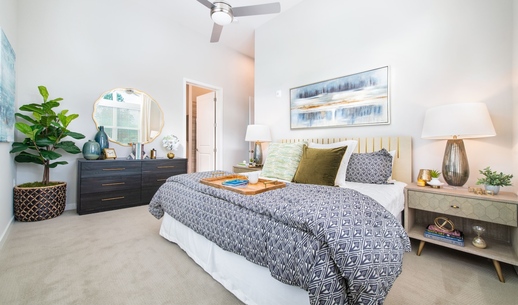 Bedroom Large well lit bedroom with plush carpet floors and large windows.