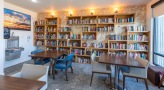 bright library with tables and chairs