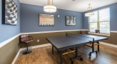 game room with a ping pong table and chairs