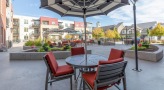 poolside patio with tables and chairs