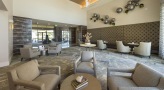 coffee tables surrounded by comfortable chairs in clubhouse