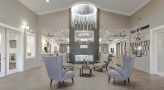 lobby with chairs, chandelier and table