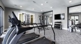 a room with treadmills and a tv