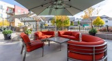 umbrella shaded table and chairs near pool