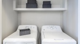 side-by-side washer/dryer units in laundry nook