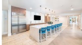 clubhouse kitchen with a large island and chairs