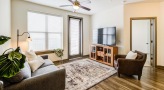 a living room with a tv and furniture