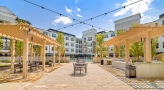 outdoor grills and eating area under pergolas