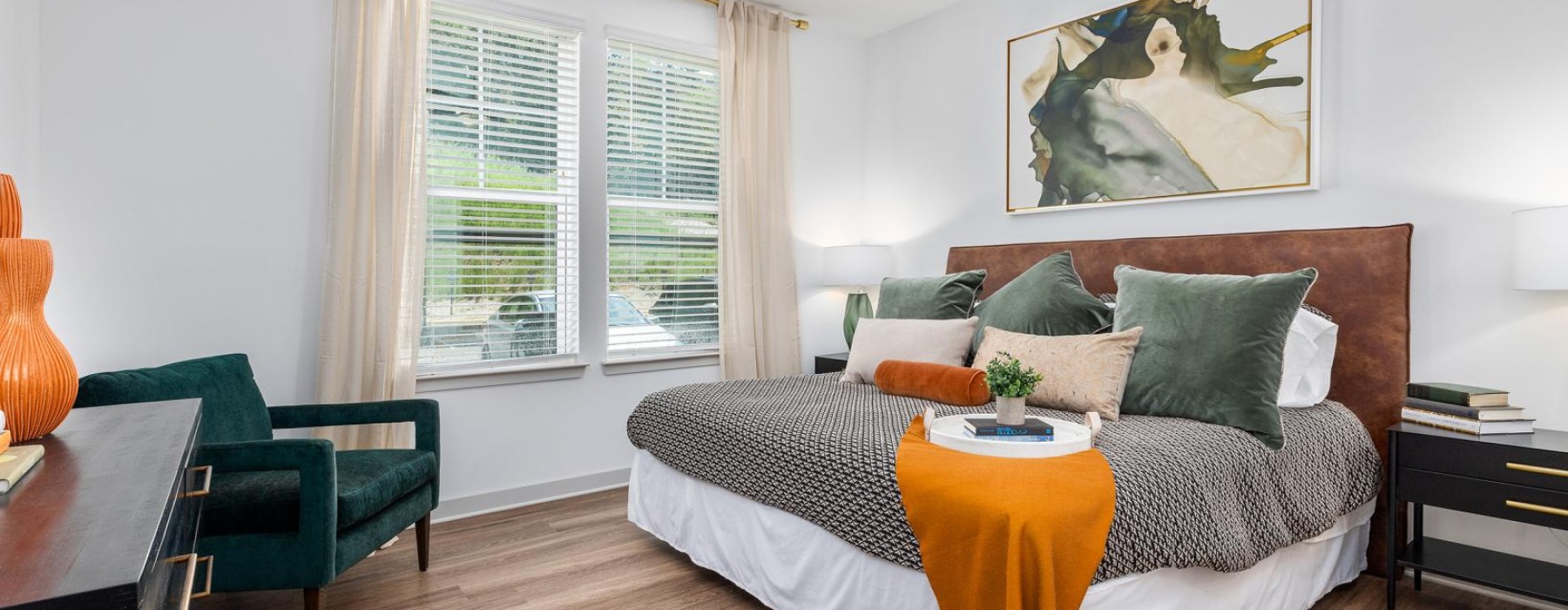 a bedroom with ceiling fan and light fixture