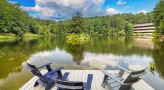 lounge chairs at the end of a dock overlooking tributary