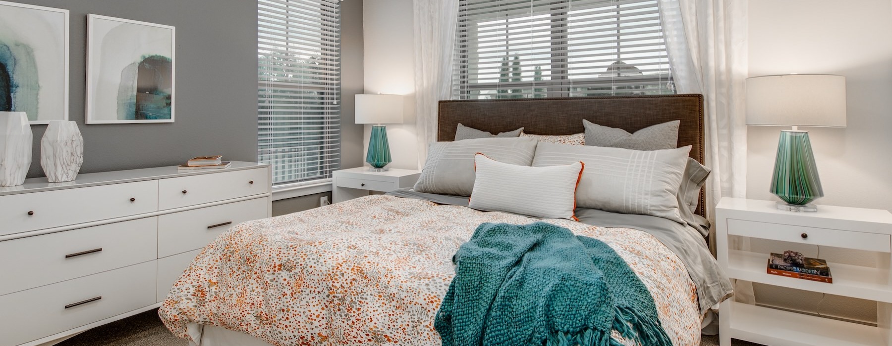 bedroom with large a large window and many decorations