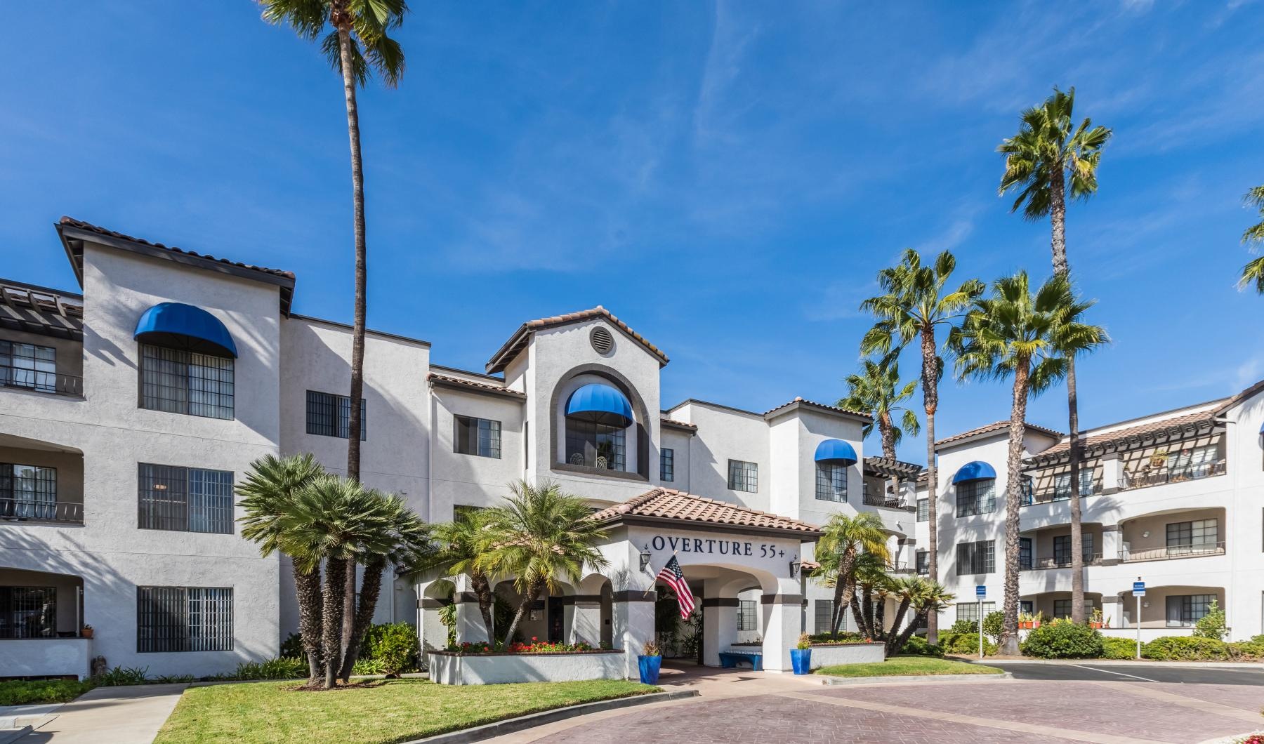 The essence of exceptional living a building with palm trees outside