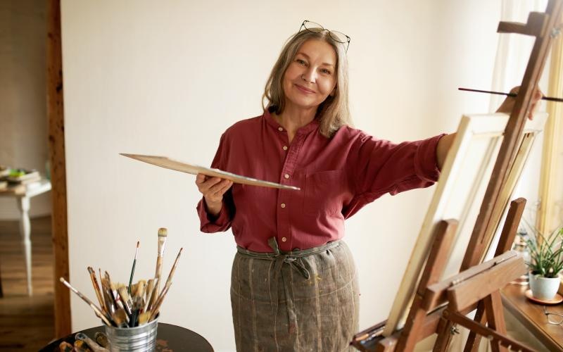 a woman painting a picture