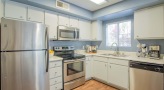 kitchen with a window and white cabinets