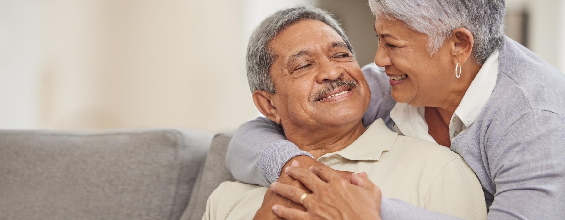 Couple hugging and smiling 