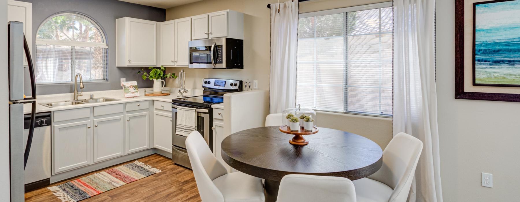 kitchen and dining area with a large window