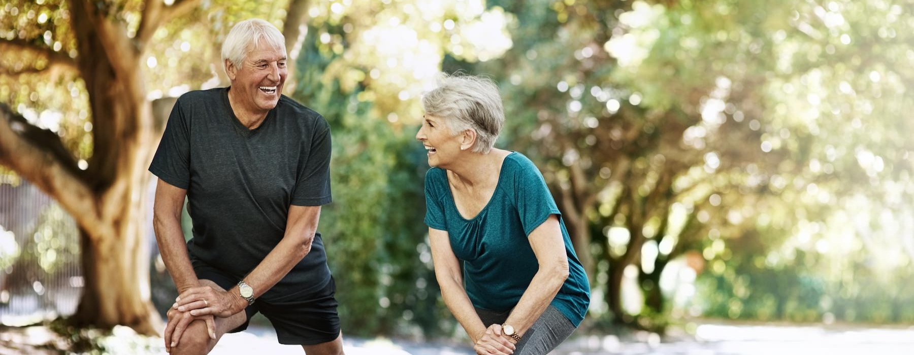 a couple outside stretching 
