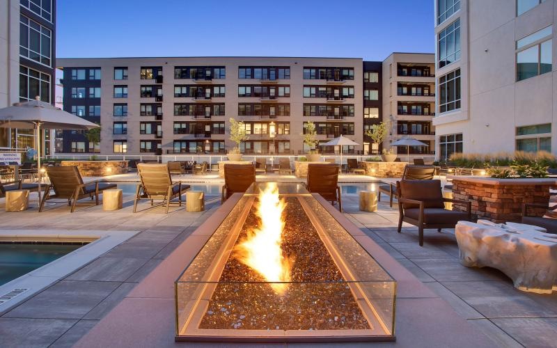 poolside fire pit and lounge chairs