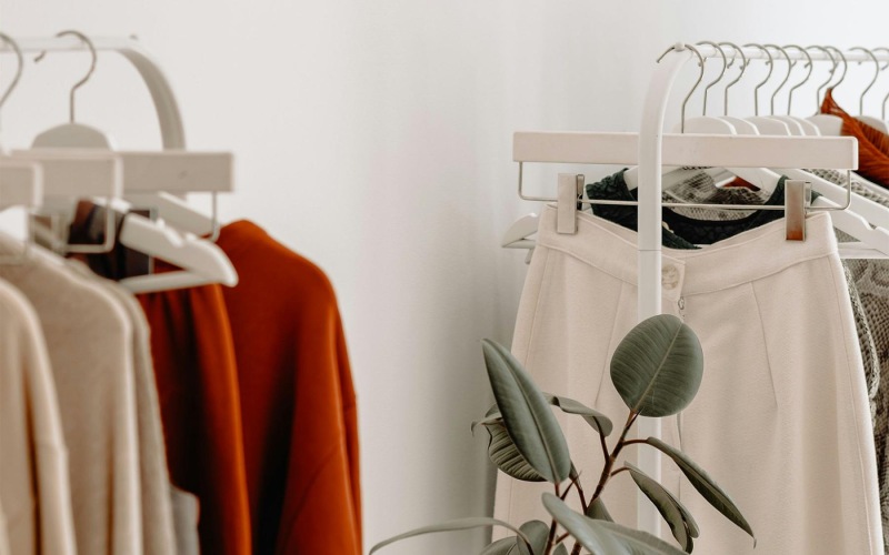 Vibrant community life with a variety of shopping options clothes on a rack near a plant
