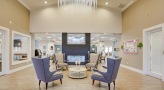 lobby area with chairs and a table
