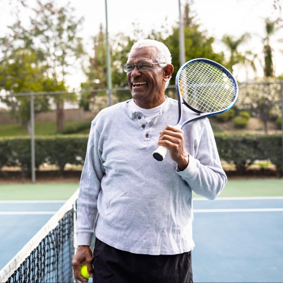 Pursue your passions at Destinations Pueblo a man on a tennis court holding a raquet