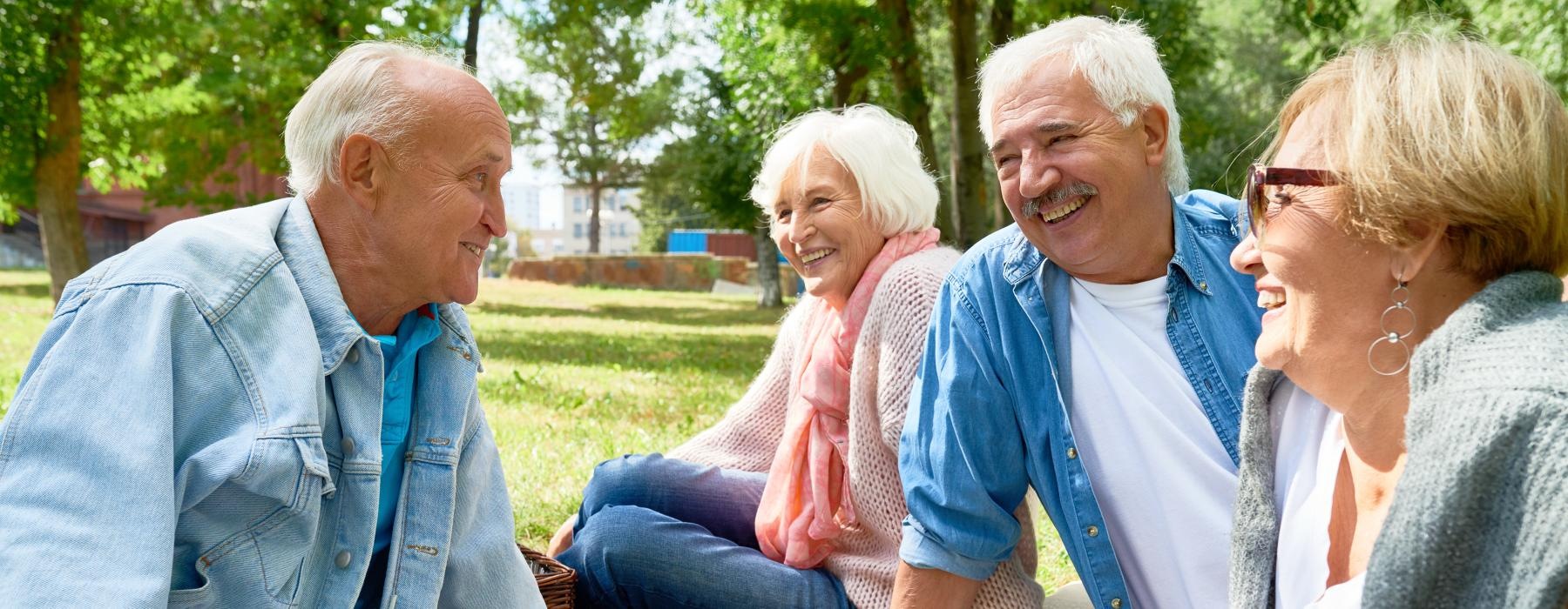 a group of people have a picnic in the park