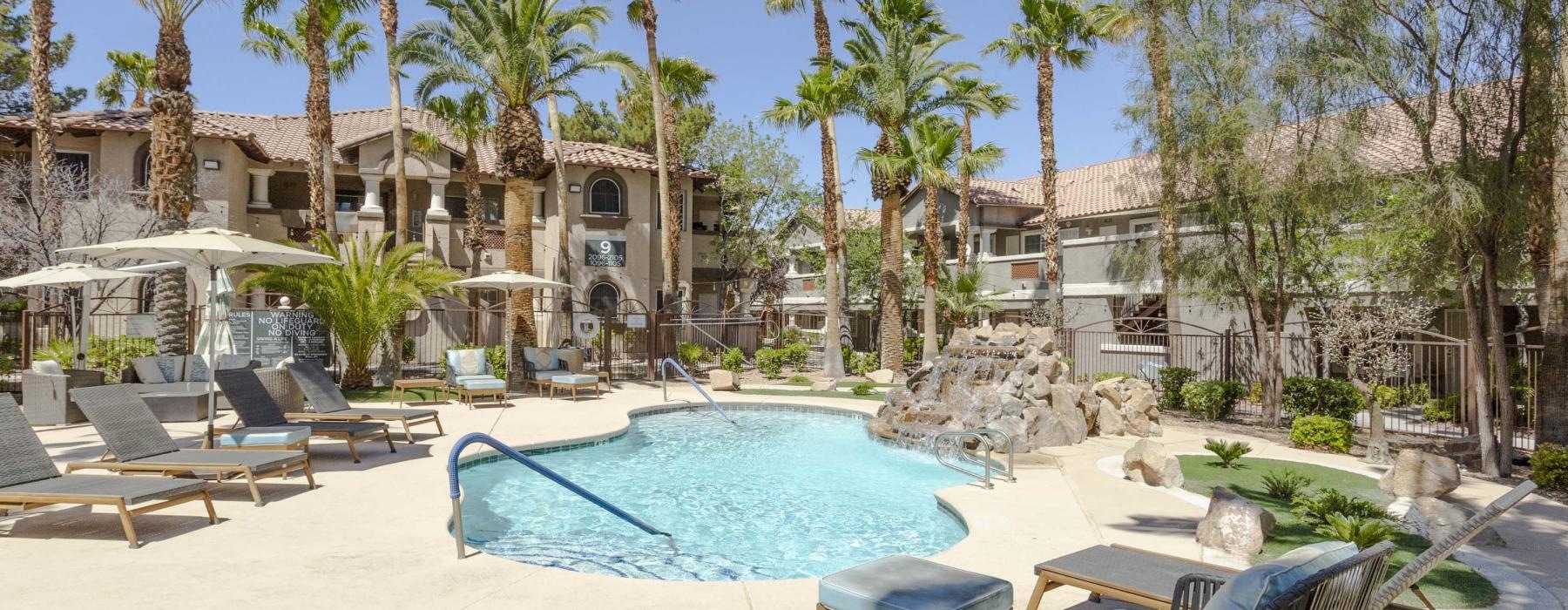 swimming pool with lounge chairs