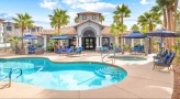 lounge chairs and cabanas around pool