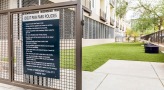 dog park entrance with a sign