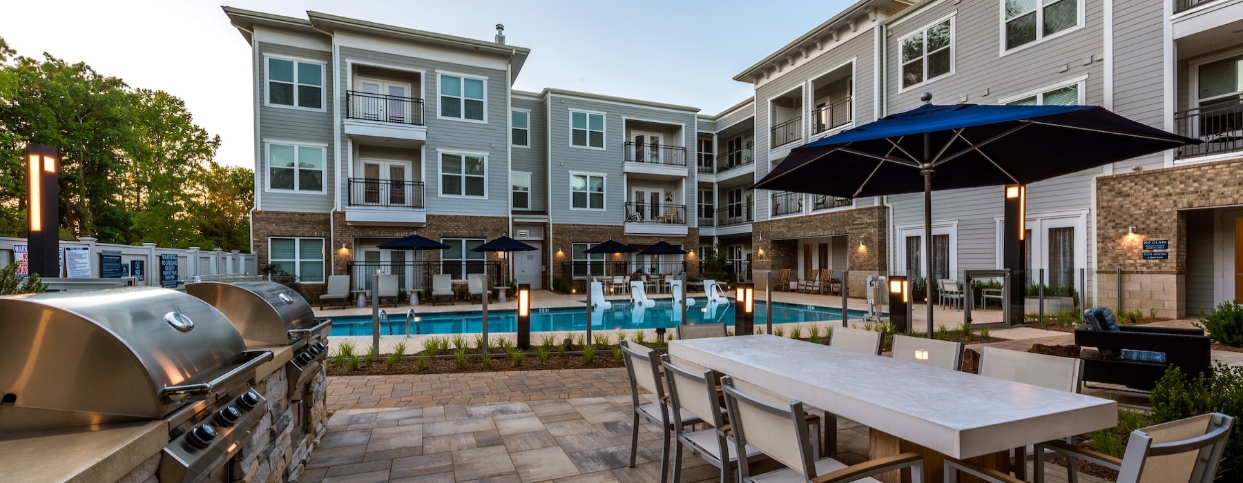 pool deck with tables and grills