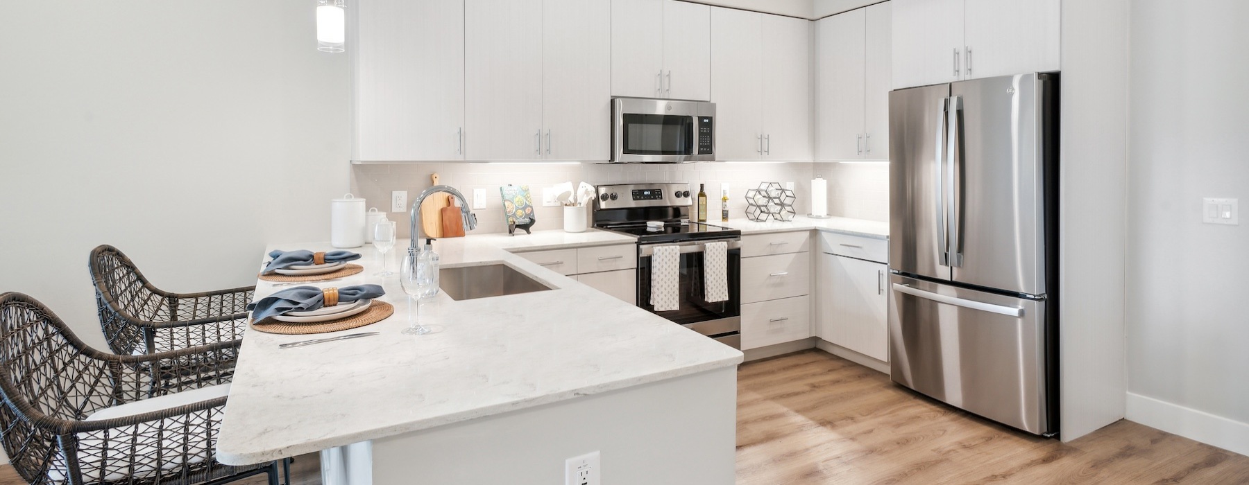 Model kitchen at Overture North Scottsdale senior community in Arizona, featuring stainless steel appliances. 