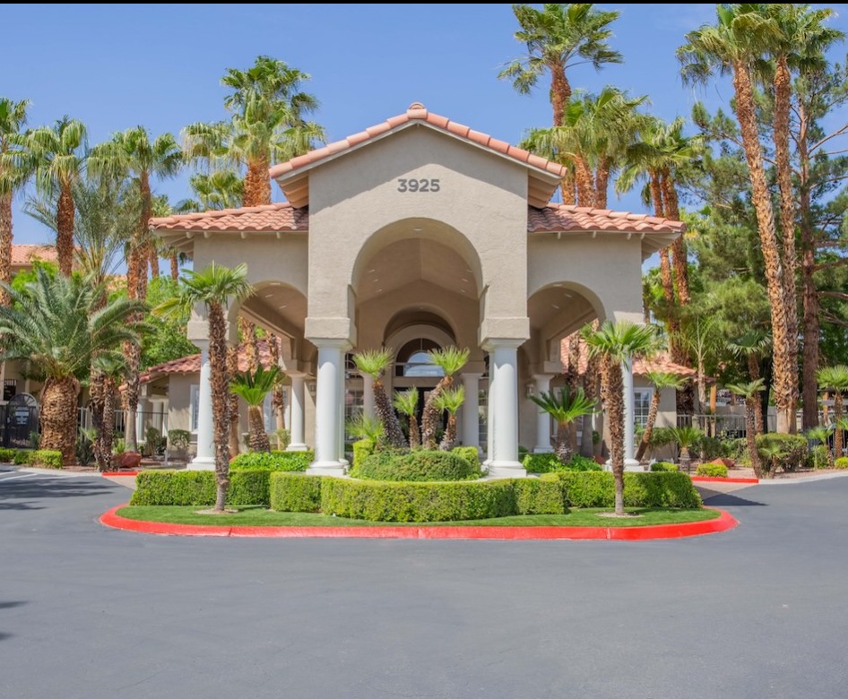 exterior of a building entrance surrounded by trees