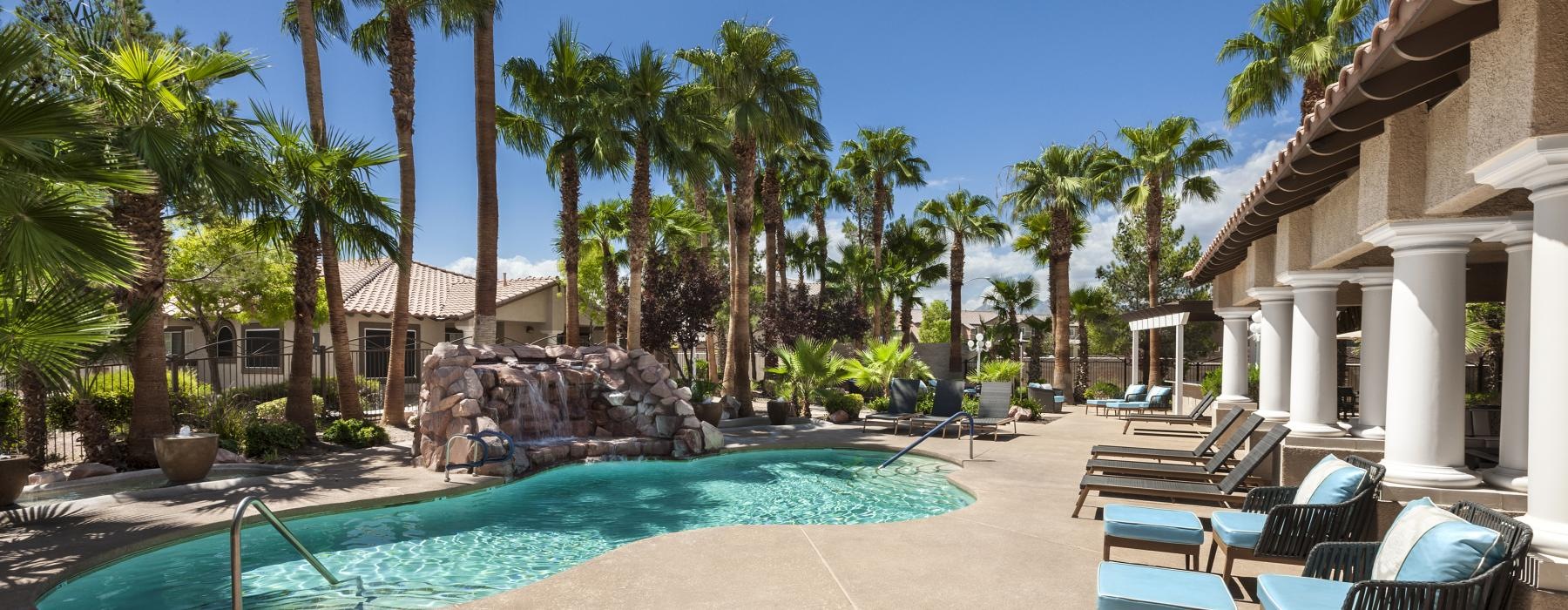 swimming pool with lounge chairs