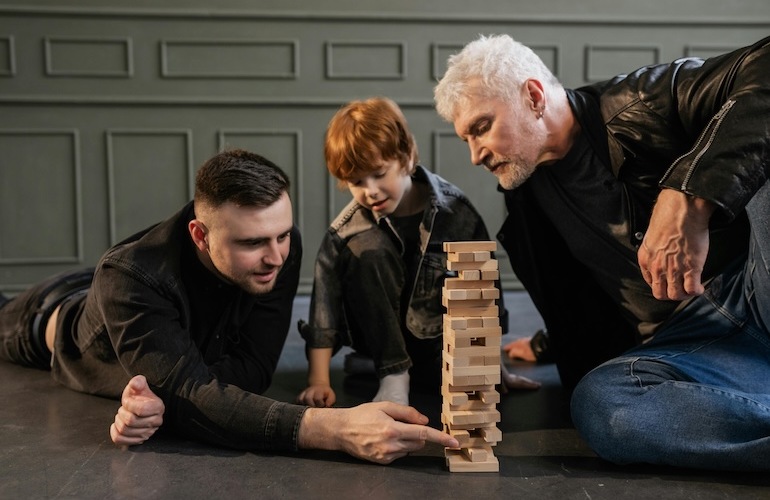 a father, son, and grandson playing a game