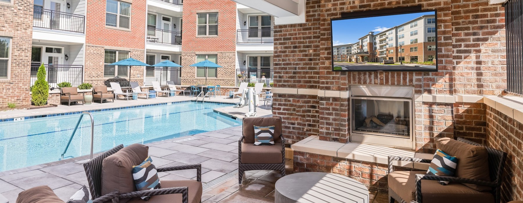 Large sparkling pool with large pool deck and lounge chairs