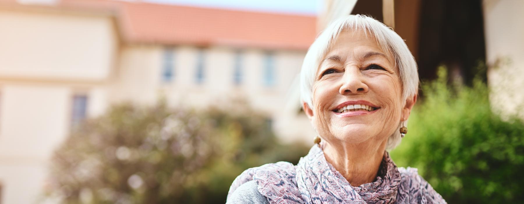 a woman smiling outside