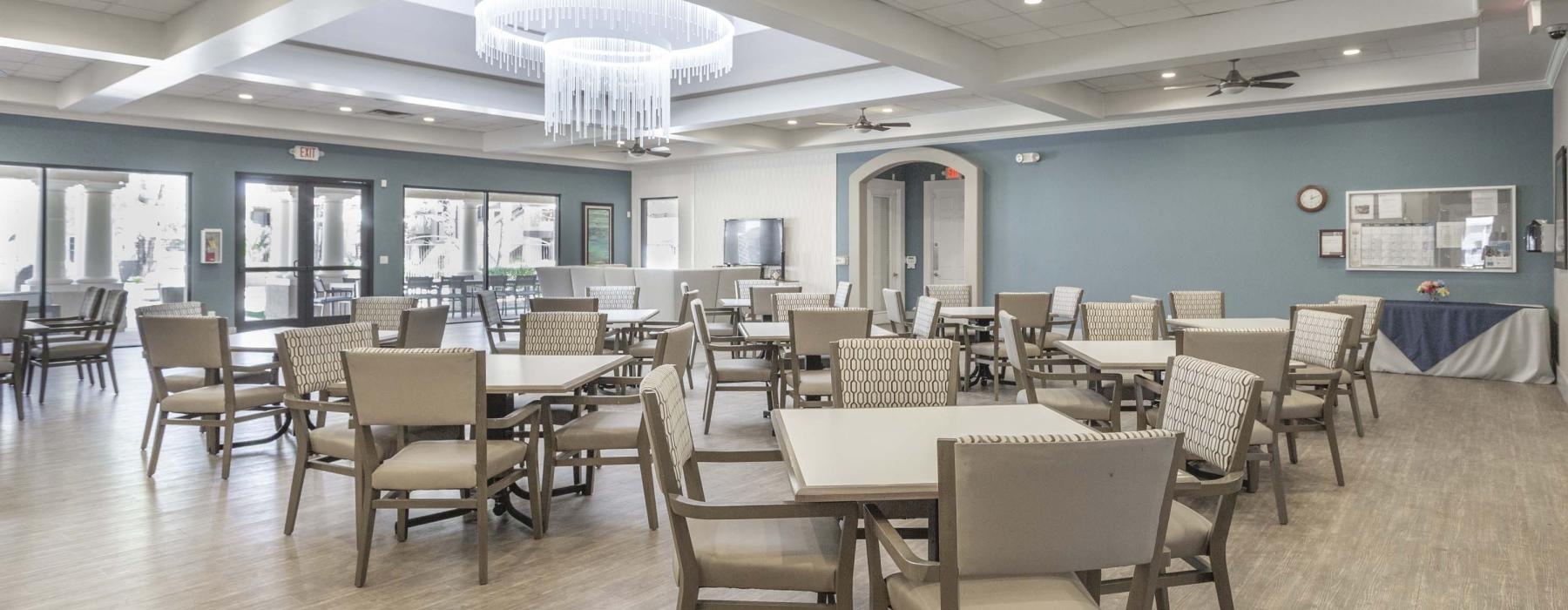 a room with tables and chairs 