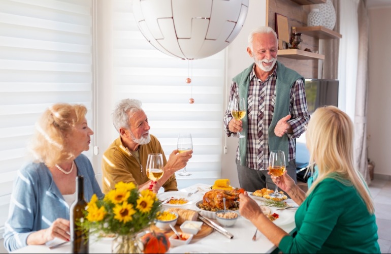 Friends having a thanksgiving meal together