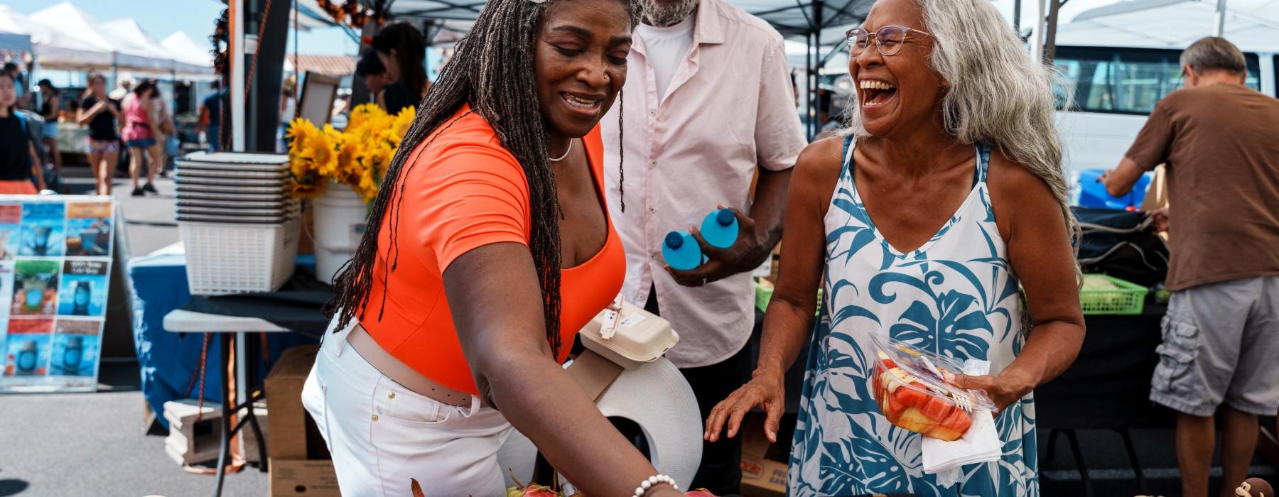 women at a local farmers market