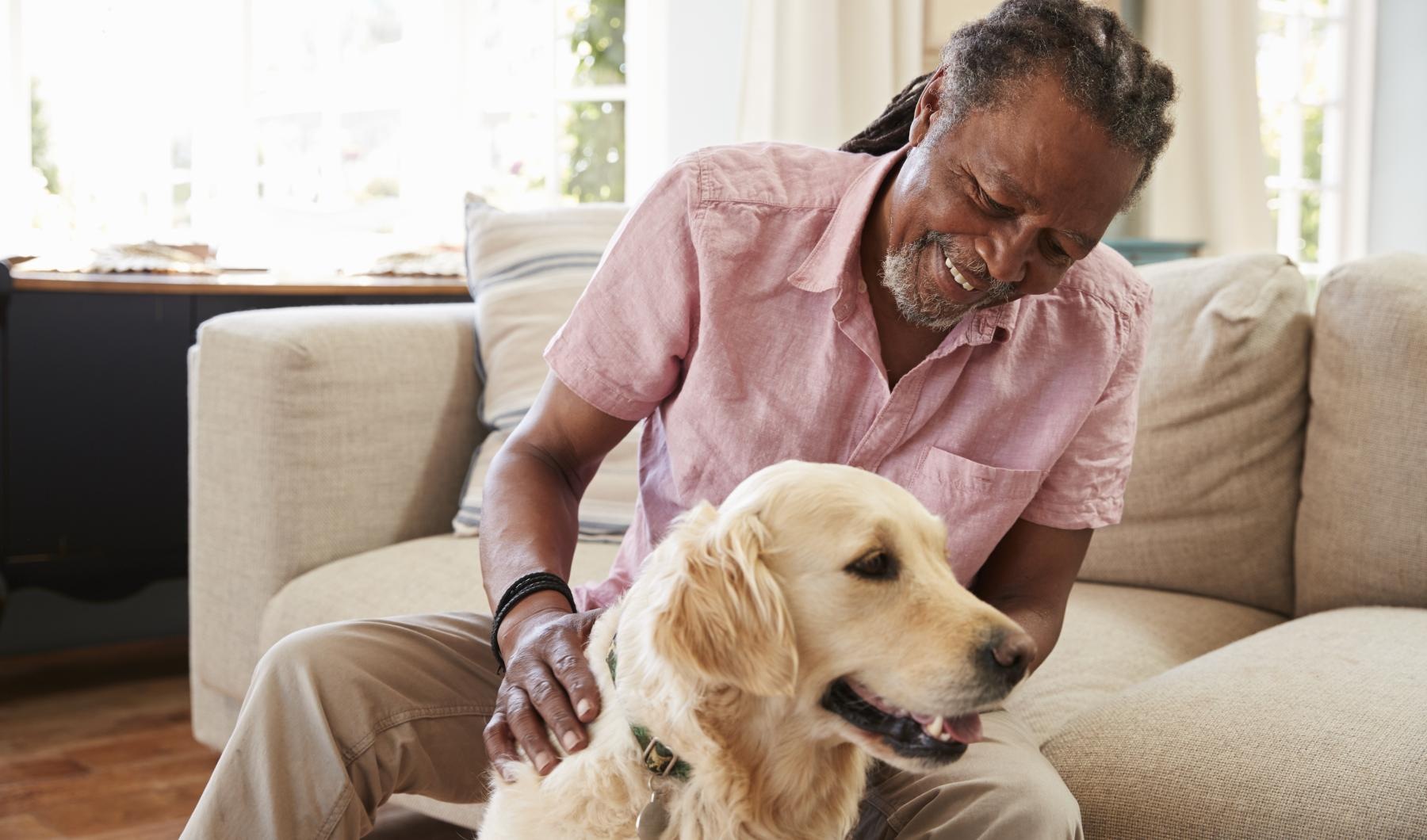 Pet-Friendly  guy with his dog in a well lit living room