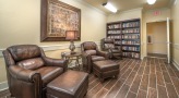 Library with two recliners and a book shelf