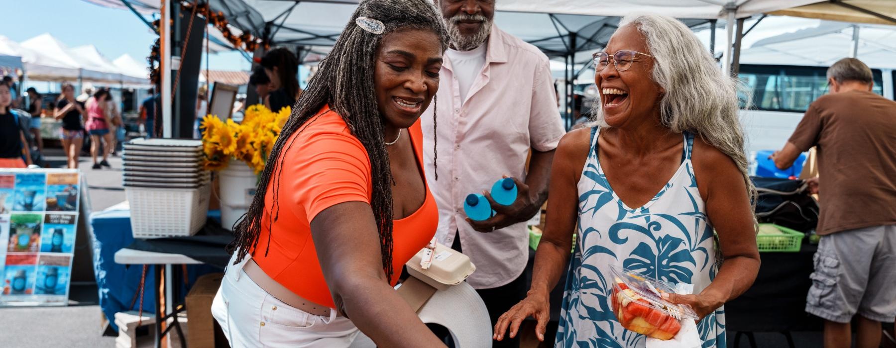 People out shopping at a local farmers market